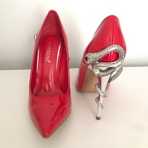 Never used gorgeous red heels with snake detail.